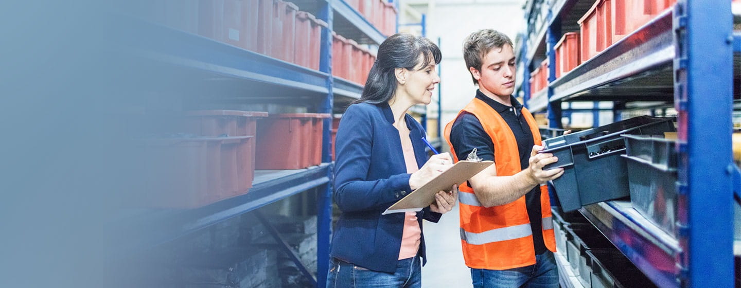 Lady is doing Inventorization of the warehouse