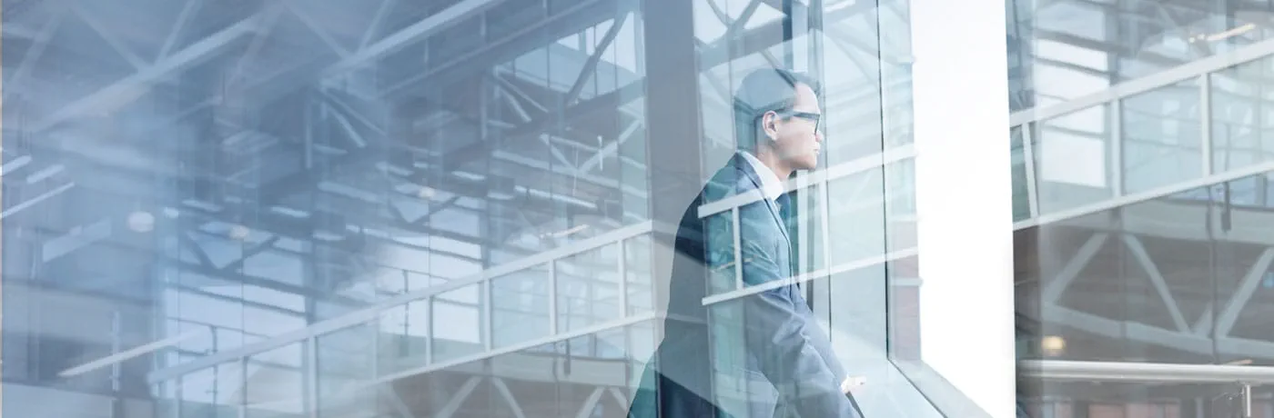 Man looking out of office window