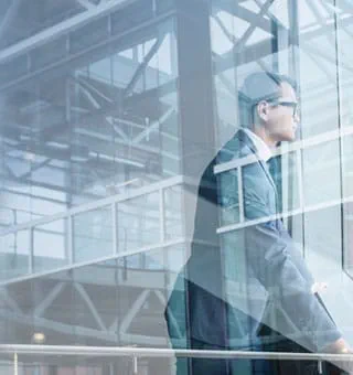 Man looking out of office window