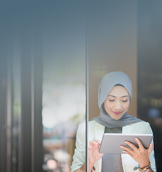 Islamic Woman browsing on a tablet